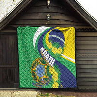 Brazil flag quilt blanket hanging outdoors, green and yellow panels with blue crest