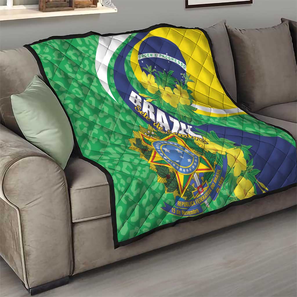 Brazil flag quilt blanket laid on couch with green, yellow, and blue geometric design