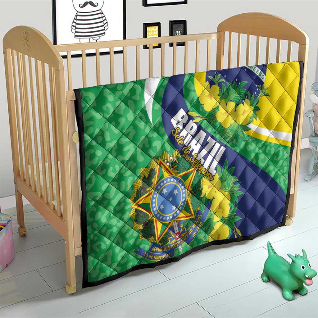 Brazil flag quilt blanket on crib, green and yellow with blue emblem and floral details