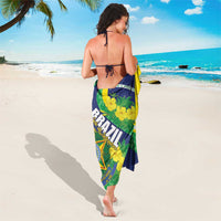 Brazil-themed sarong in green, navy, and yellow with floral and crest print