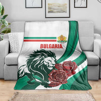 Bulgaria blanket on gray sofa, green-striped lion and red rose artwork
