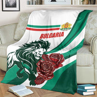 Draped Bulgaria blanket showing lion face, red roses, and green stripe panel