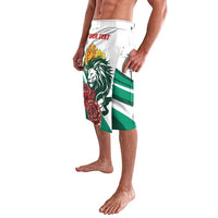 White lava lava shorts with lion and rose graphic, green stripe accents at hem