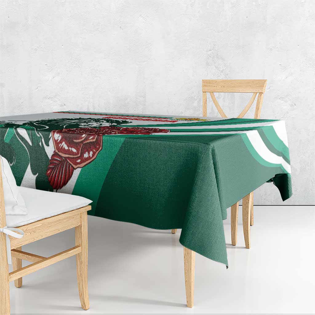 Green and white tablecloth draped over wooden bench; lion and rose emblem