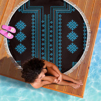 Round blue patterned beach blanket with white fringe edge, flat on a mat