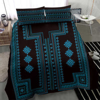 Blue and black bedding set with large central geometric motif and pillow covers
