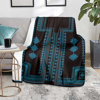 Traditional geometric blanket, dark base with bright blue borders and diamond shapes