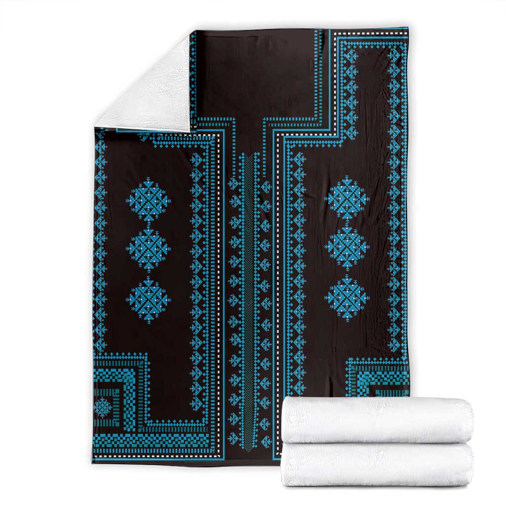 Traditional geometric pattern blanket, dark background with bright blue frame and diamonds