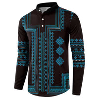 Traditional pattern henley sweatshirt, dark base with bright blue geometric print and long sleeves.