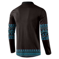 Traditional pattern sweatshirt back view, dark fabric with blue geometric bands on sleeves and hem.