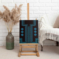 Blue canvas wall art on wooden easel, teal geometric pattern on dark background