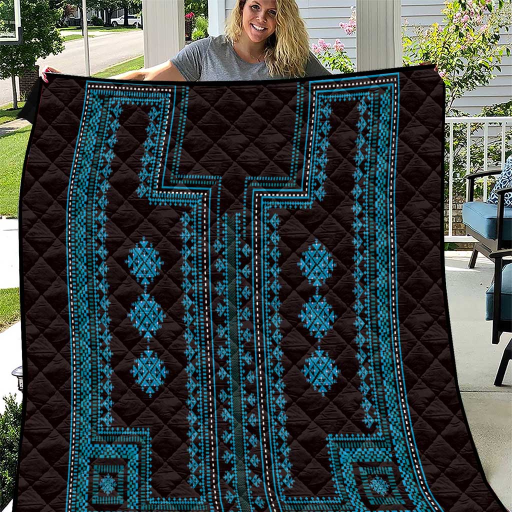 Black quilt blanket with large blue geometric medallion and border panels