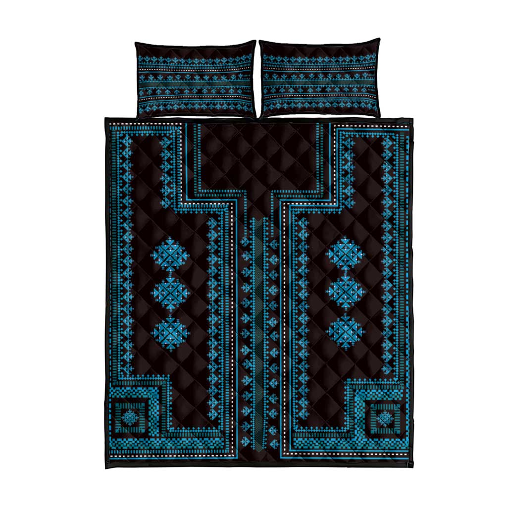 Blue geometric quilt bed set with quilted pattern and matching pillow shams