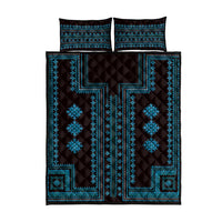 Blue geometric quilt bed set with quilted pattern and matching pillow shams