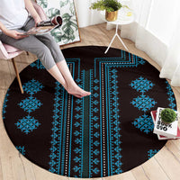Round traditional pattern rug with dark background and vivid blue vertical stripes