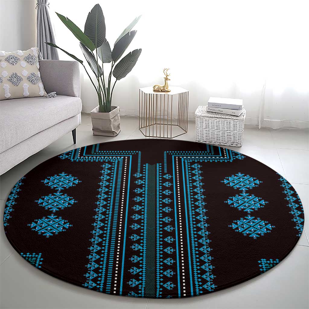 Round woven rug featuring dark brown base and symmetrical blue diamond motifs