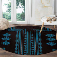 Round carpet with dark base and scattered blue geometric cross and diamond motifs