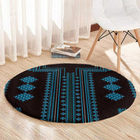 Round rug with dark background and central blue striped medallion design