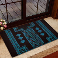 Black rubber doormat featuring blue zigzag bands and repeating geometric emblems