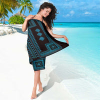 Blue geometric-pattern sarong on black base with bold border motifs
