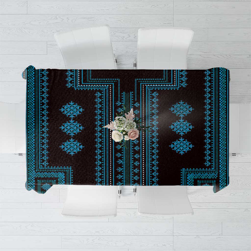 Geometric tablecloth top view: blue motifs on dark background