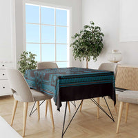 Blue and black geometric tablecloth on dining table with upholstered chairs