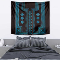 Traditional wall tapestry above bed, blue geometric pattern on dark fabric