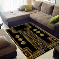Black area rug with gold geometric stripe bands and corner ornament details