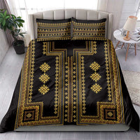Black and gold patterned bedding set with duvet cover and two pillow shams