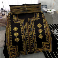 Black and gold patterned bedding set with duvet cover and two pillow shams