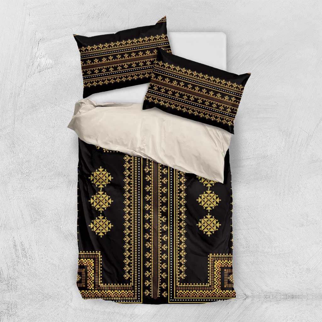 Black and gold bedding set flat lay: duvet cover and two matching pillow shams