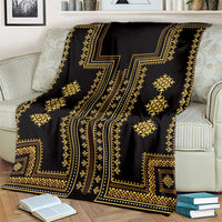 Dark throw blanket with gold patterned blocks and diamond ornaments