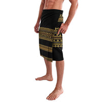 Black and gold wrap shorts with geometric band pattern and angled side drape