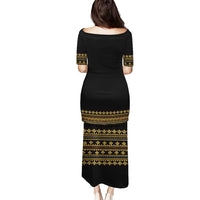 Black long dress, back view, gold geometric bands and trim, short sleeves