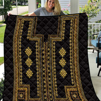 Black quilt with gold traditional geometric panels and diamond motifs, stitched in a quilted pattern.
