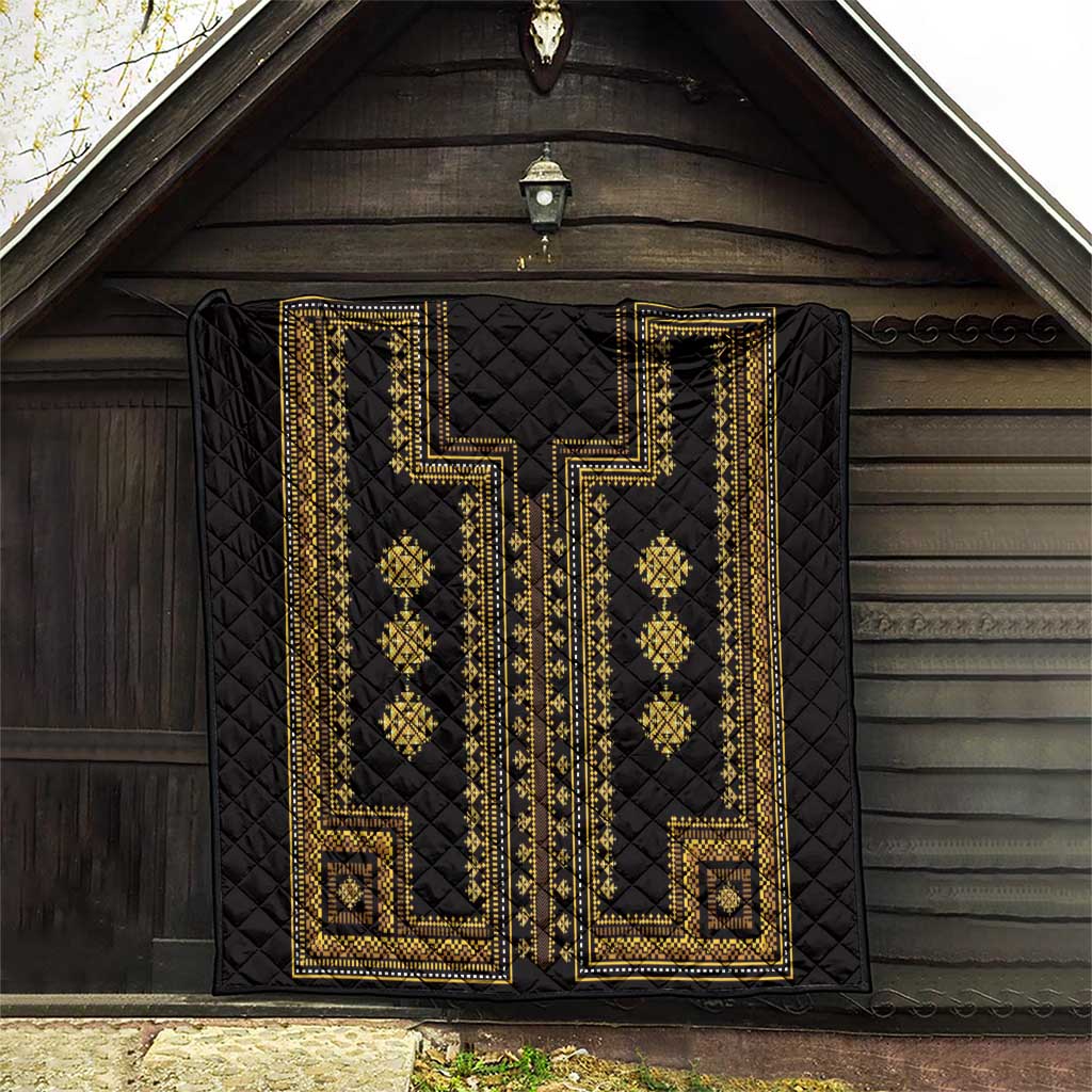 Black quilt blanket with gold embroidered-style geometric frame, diamond accents, and corner squares.