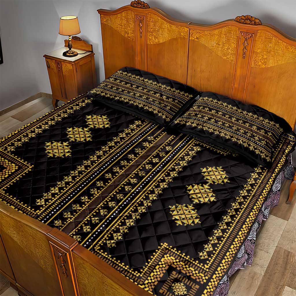 Black quilt bed set with gold geometric bands and two matching pillow shams