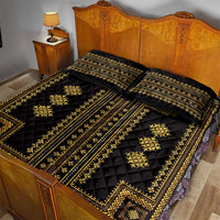 Black quilt bed set with gold geometric bands and two matching pillow shams