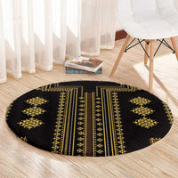 Round black area rug with gold vertical stripes and diamond star medallions.