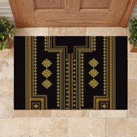 Rectangular rubber doormat with black base and gold geometric Balkan pattern