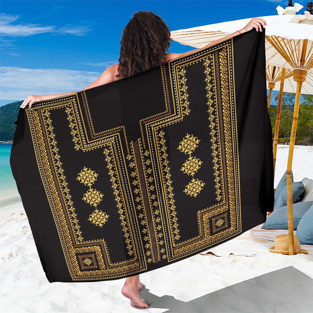 Black and gold geometric sarong shown laid open with large center pattern