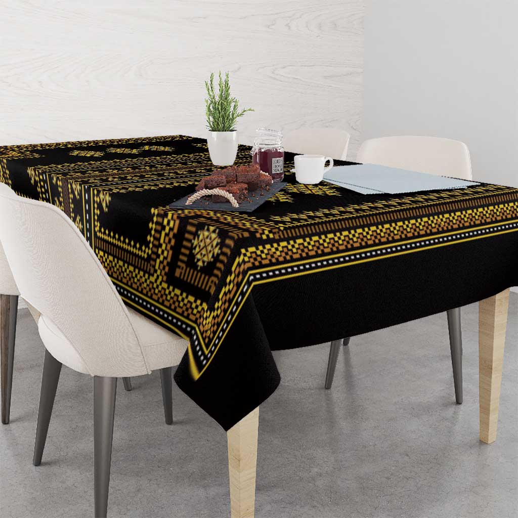 Traditional geometric tablecloth in dark with gold trim, laid across dining table