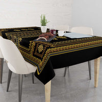 Traditional geometric tablecloth in dark with gold trim, laid across dining table