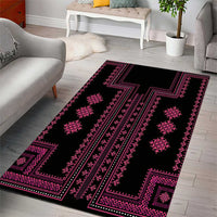 Black area rug with pink geometric Balkan pattern and border design