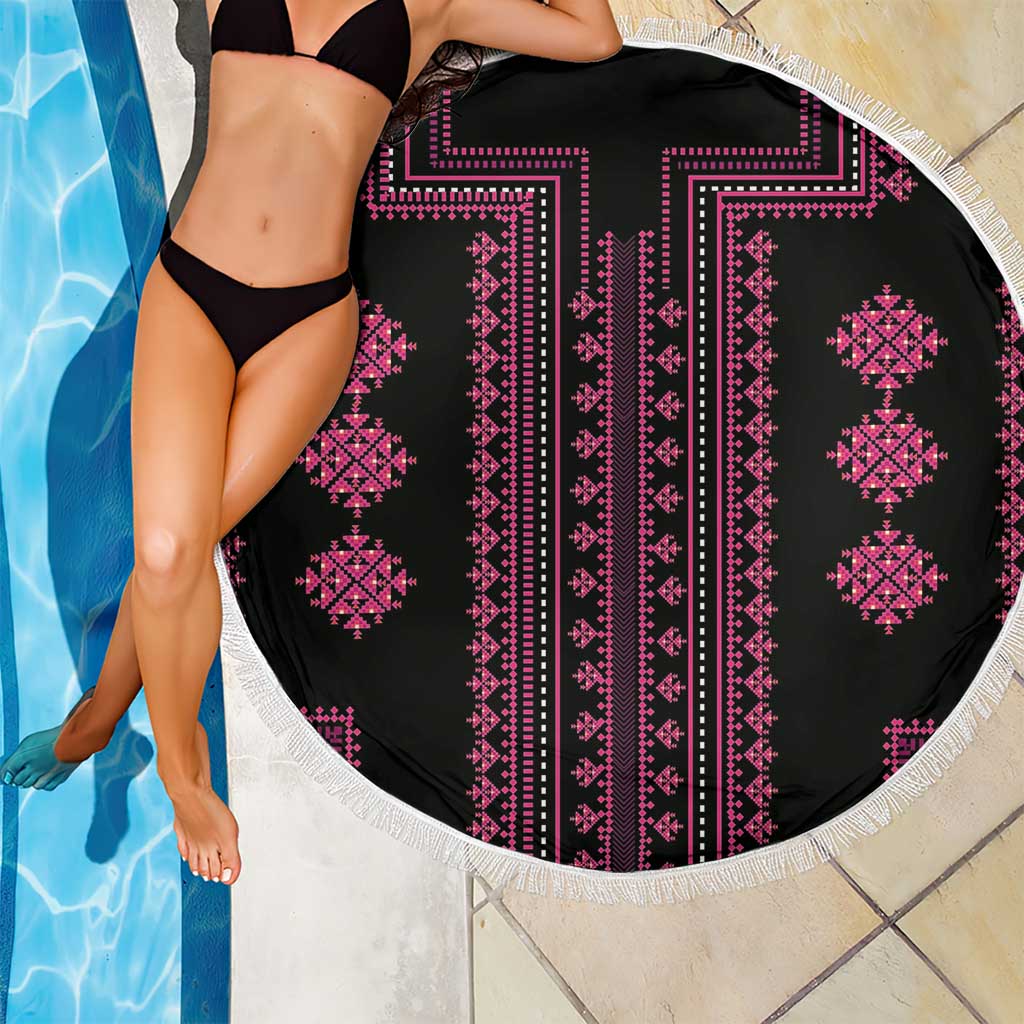 Round beach blanket with black fabric, pink geometric stripes, and white fringe edge