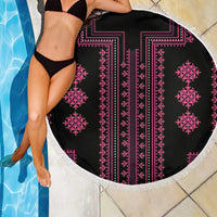 Round beach blanket with black fabric, pink geometric stripes, and white fringe edge