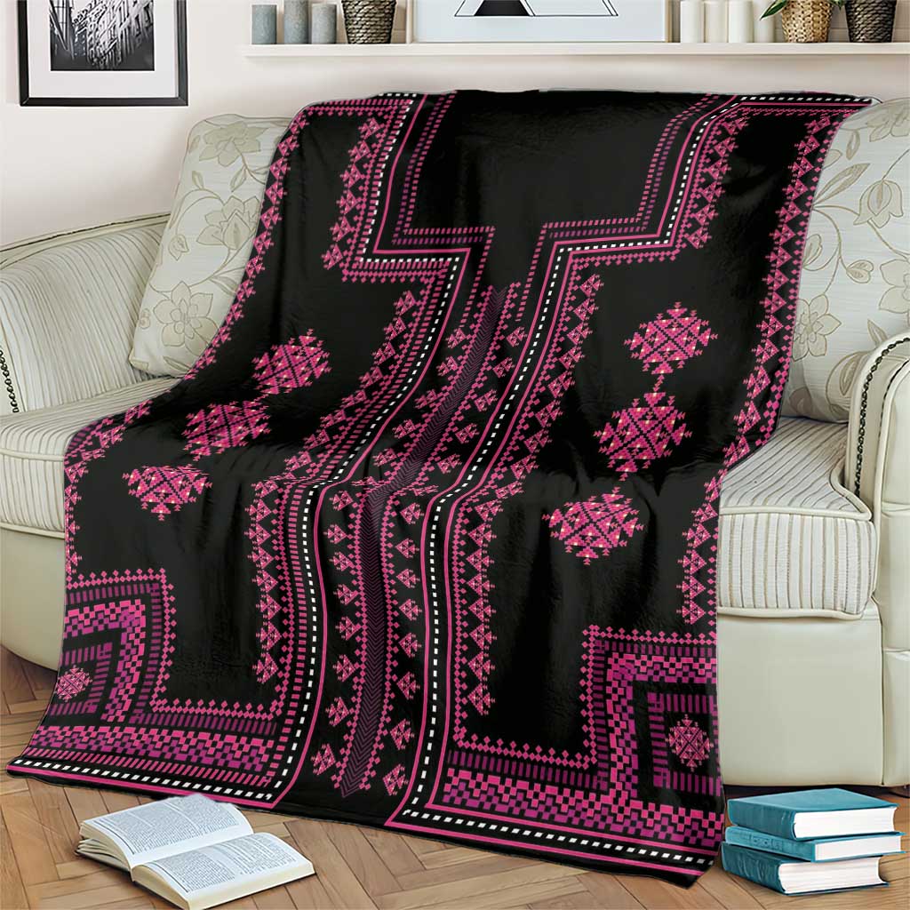 Black and pink traditional patterned throw blanket with diamond and stripe motifs
