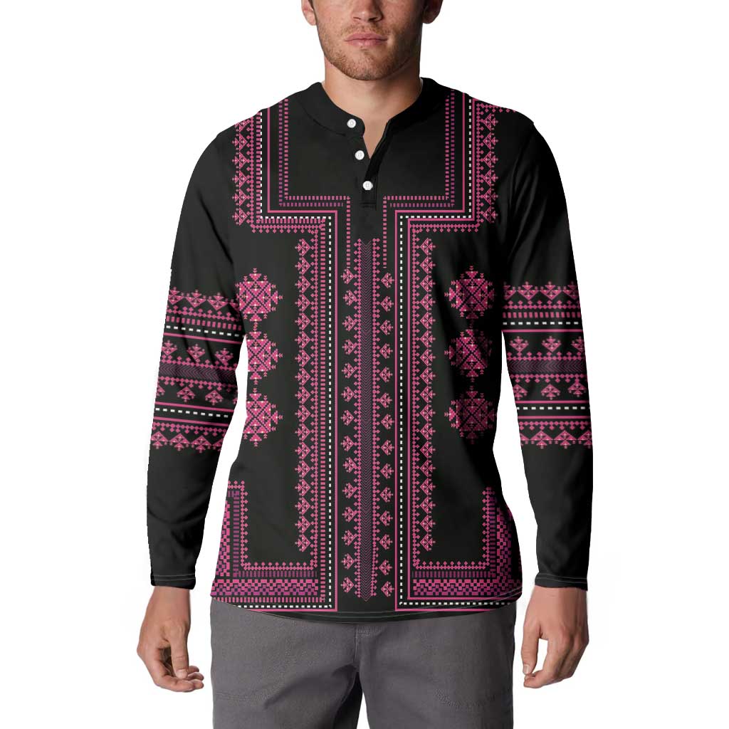 Black long-sleeve sweatshirt with pink embroidered-style cross panel and button placket.