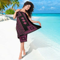 Black sarong with magenta geometric panel and scattered floral motif accents