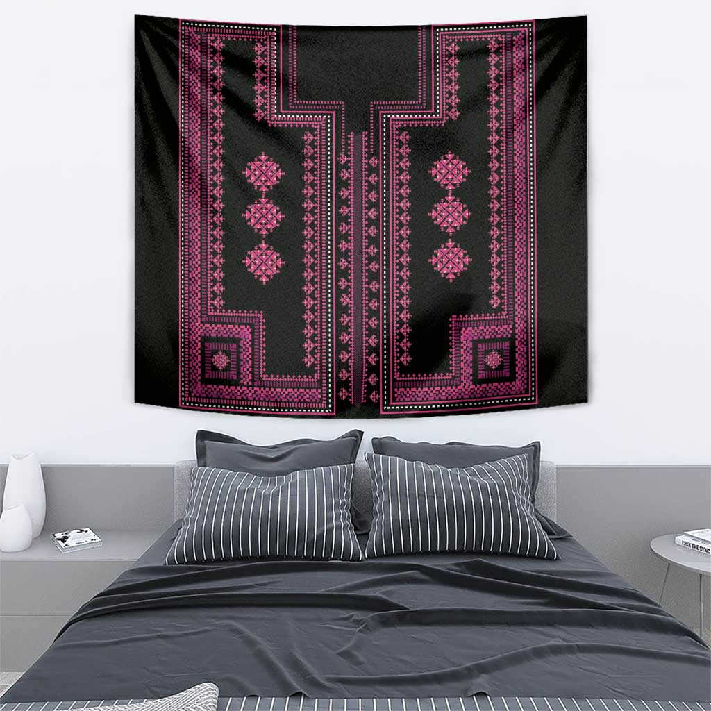 Black tapestry featuring two tall geometric columns with pink diamond and cross motifs.